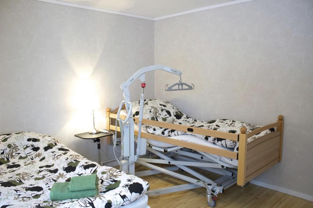 Postel nebo postele na pokoji v ubytování Mellangården