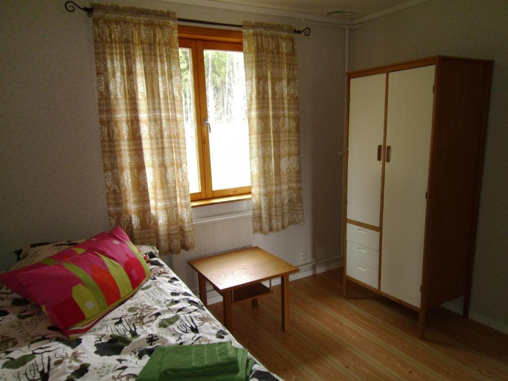 Postel nebo postele na pokoji v ubytování Mellangården