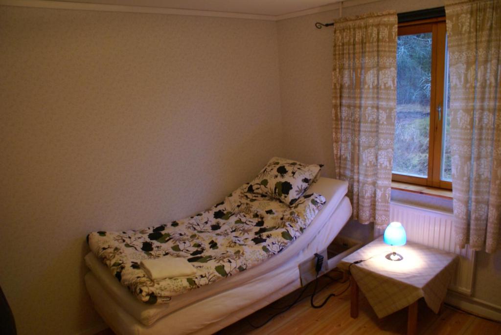Postel nebo postele na pokoji v ubytování Mellangården