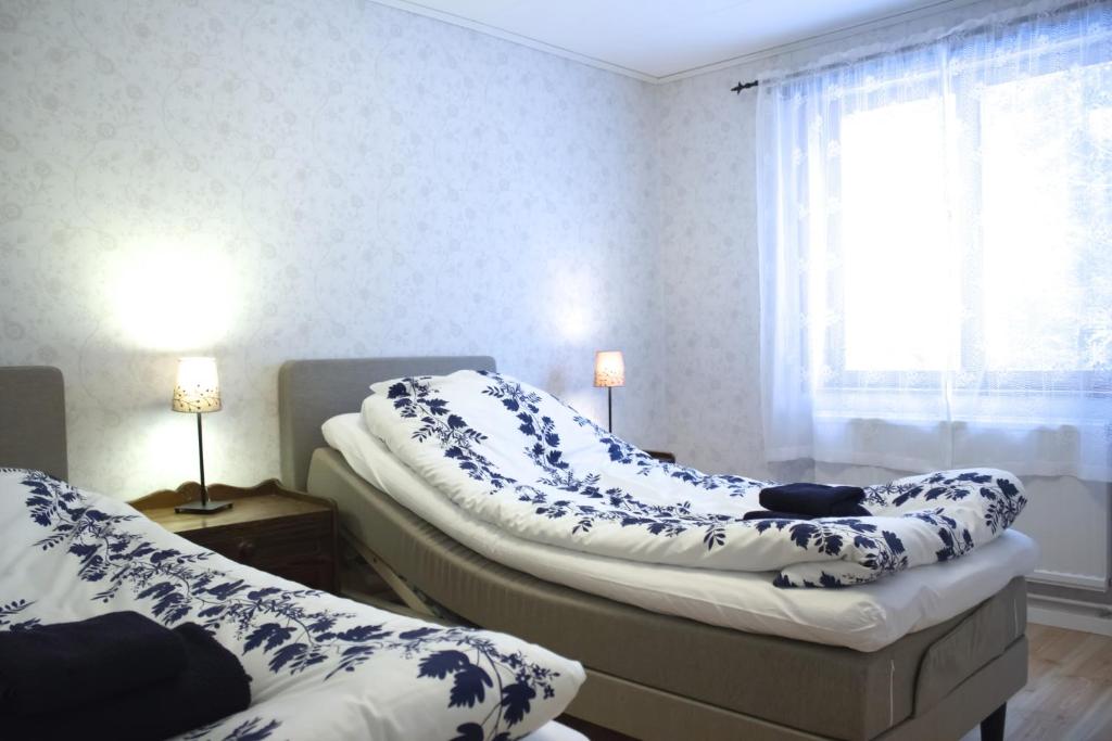 Postel nebo postele na pokoji v ubytování Mellangården