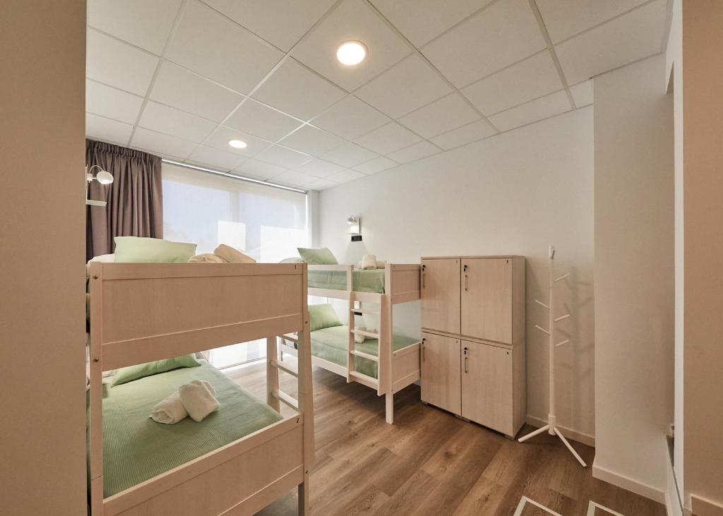 Postel nebo postele na pokoji v ubytování ALBERGUE SEGUE O CAMIÑO