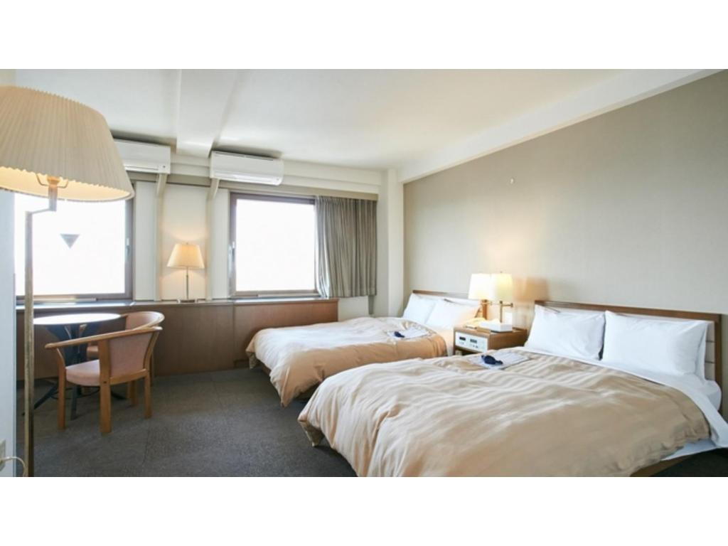 Ένα ή περισσότερα κρεβάτια σε δωμάτιο στο Kanku Sun Plus Yutaka - Vacation STAY 38978v