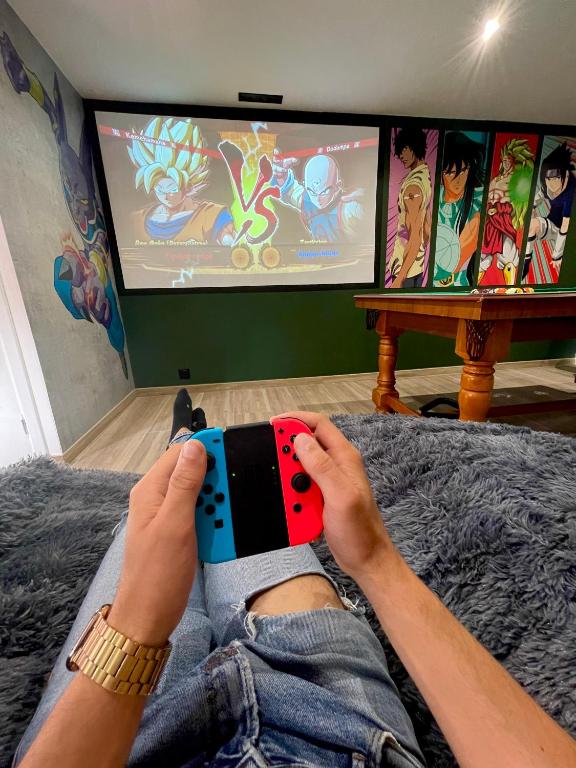 Televízia a/alebo spoločenská miestnosť v ubytovaní Capsule Manga - Jacuzzi - Billard - Nintendo Switch - Netflix