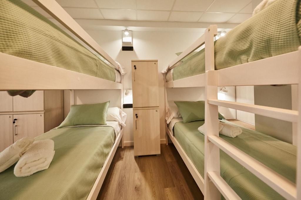 Postel nebo postele na pokoji v ubytování ALBERGUE SEGUE O CAMIÑO