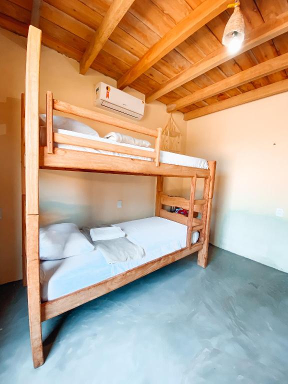 Postel nebo postele na pokoji v ubytování Caramuru Hostel Caraíva