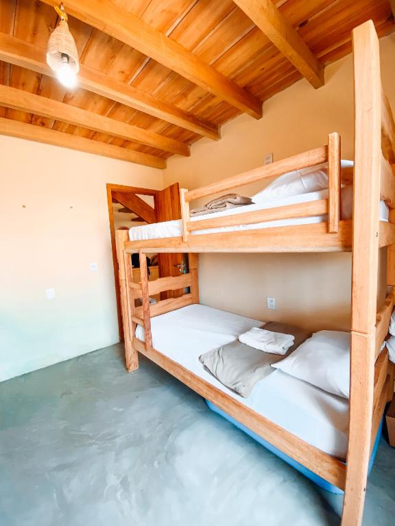 Postel nebo postele na pokoji v ubytování Caramuru Hostel Caraíva