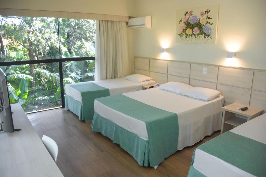 Postel nebo postele na pokoji v ubytování Hotel Nacional Inn Foz do Iguaçu
