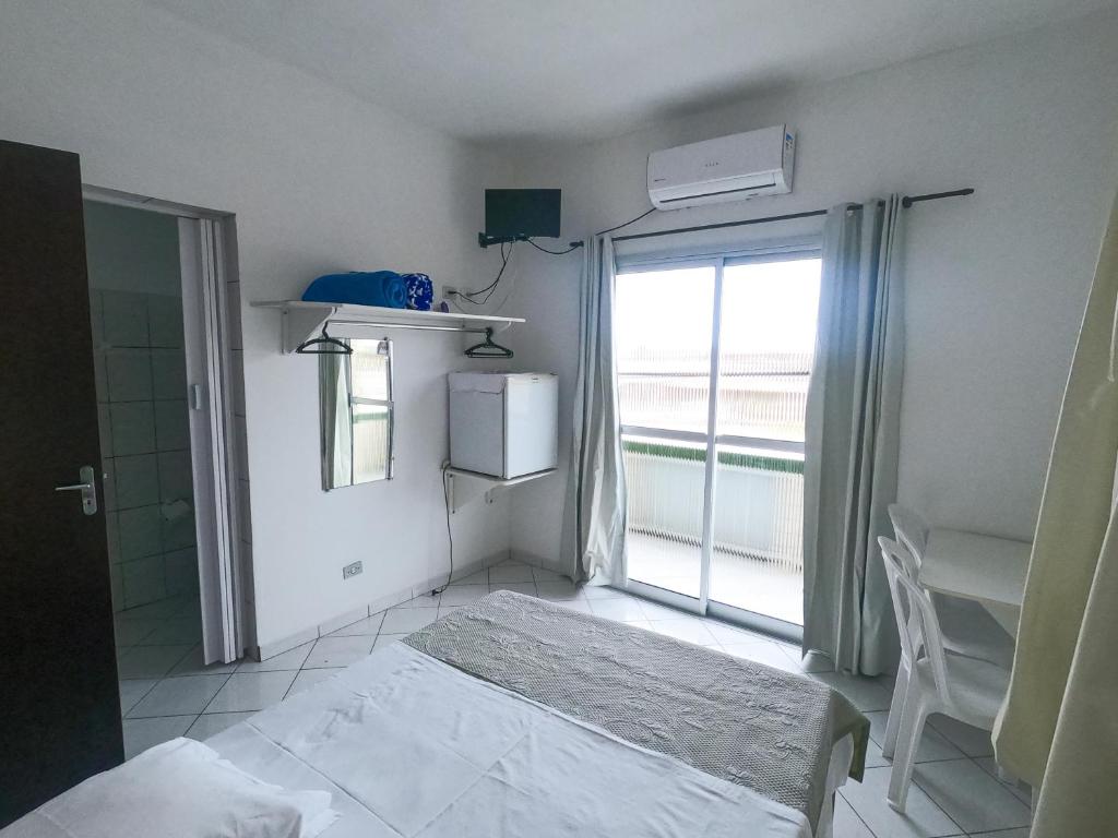 Postel nebo postele na pokoji v ubytování HOTEL MORADA DO SOL