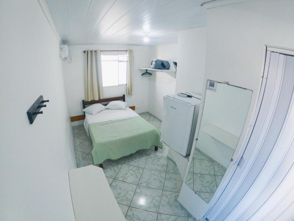 Postel nebo postele na pokoji v ubytování HOTEL MORADA DO SOL