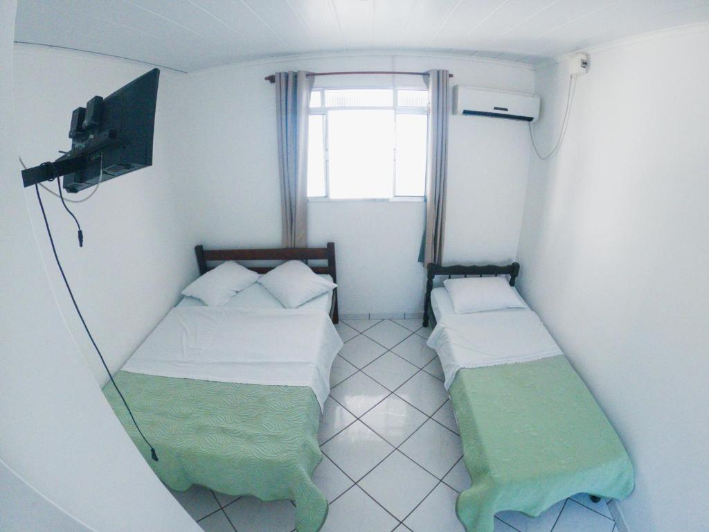 Postel nebo postele na pokoji v ubytování HOTEL MORADA DO SOL