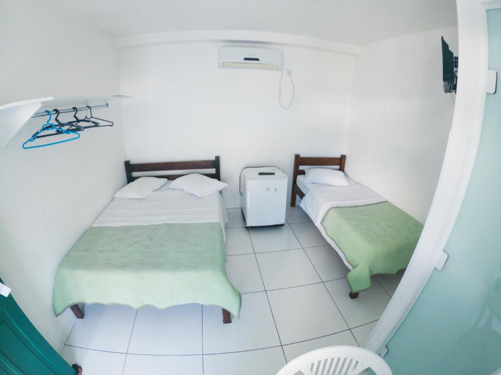 Postel nebo postele na pokoji v ubytování HOTEL MORADA DO SOL