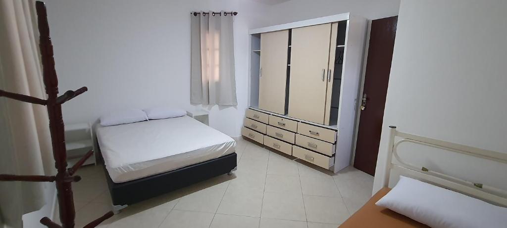 Ένα ή περισσότερα κρεβάτια σε δωμάτιο στο Beach House uma casa no Caribe brasileiro