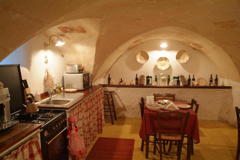 Kuchyň nebo kuchyňský kout v ubytování B&B Archidamo