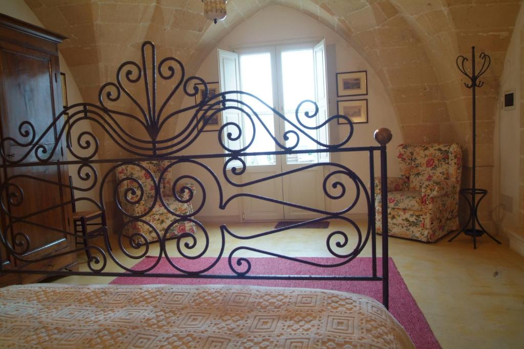 Postel nebo postele na pokoji v ubytování B&B Archidamo