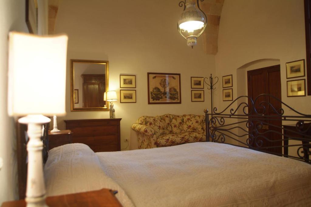 Postel nebo postele na pokoji v ubytování B&B Archidamo