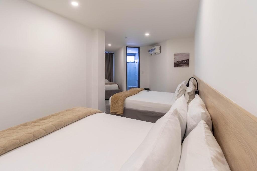 Postel nebo postele na pokoji v ubytování Bianco Hotel Boutique