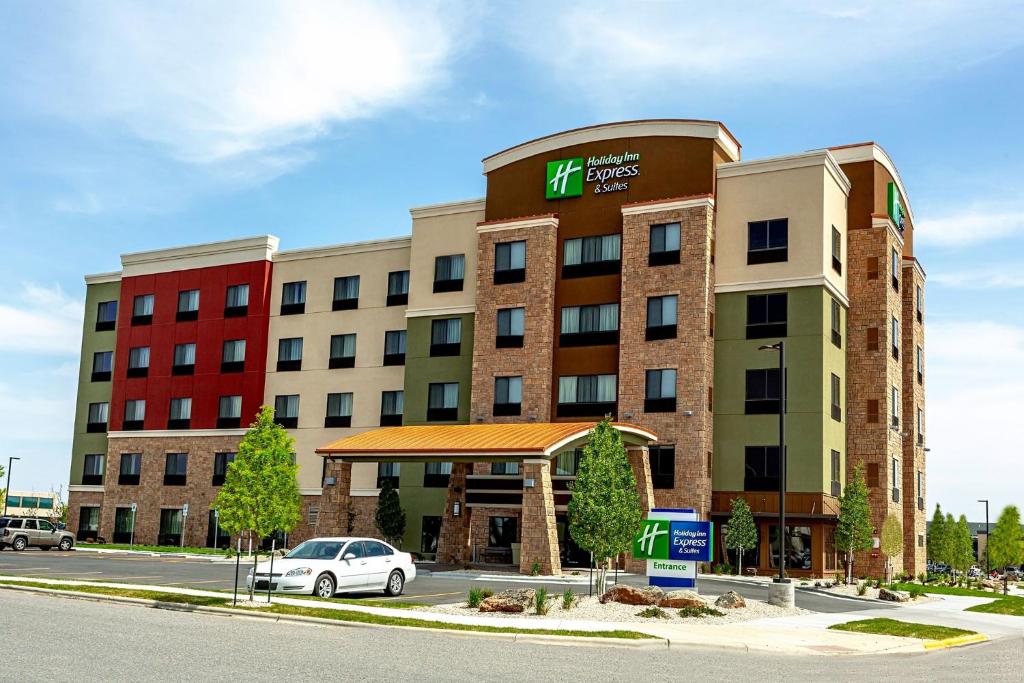 a hotel building with a car parked in front of it at Holiday Inn Express Hotel & Suites Billings, an IHG Hotel in Billings