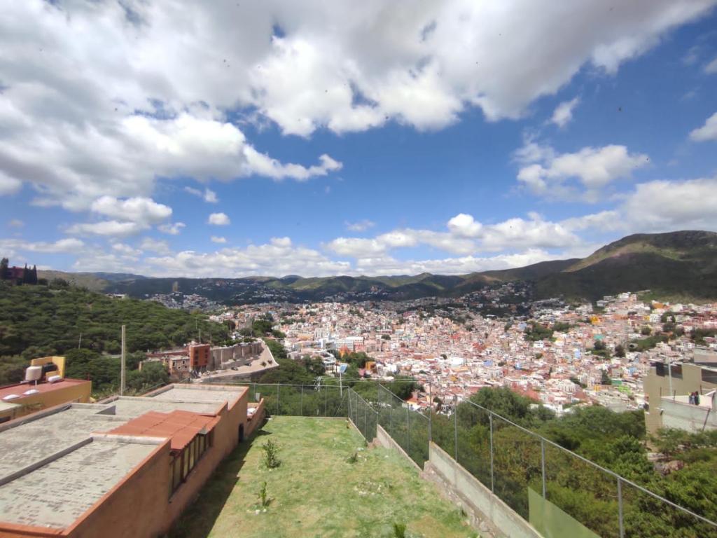 a view of the city from the fortress at La Casa Rosa Guanajuato in Guanajuato