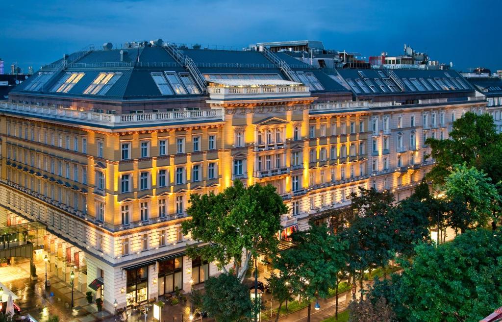 a large building in a city at night at Grand Hotel Wien in Vienna