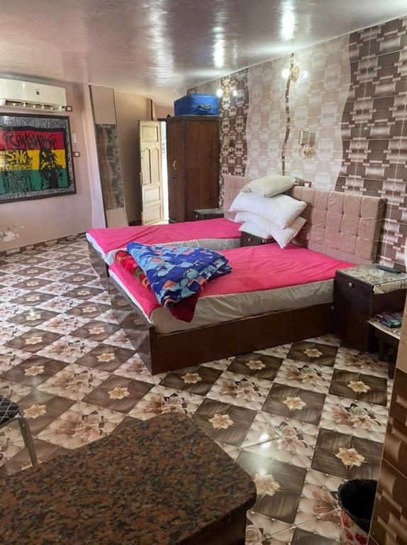 Postel nebo postele na pokoji v ubytování Nubian Dreams Guest House