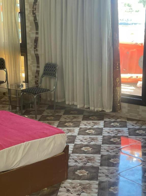Postel nebo postele na pokoji v ubytování Nubian Dreams Guest House