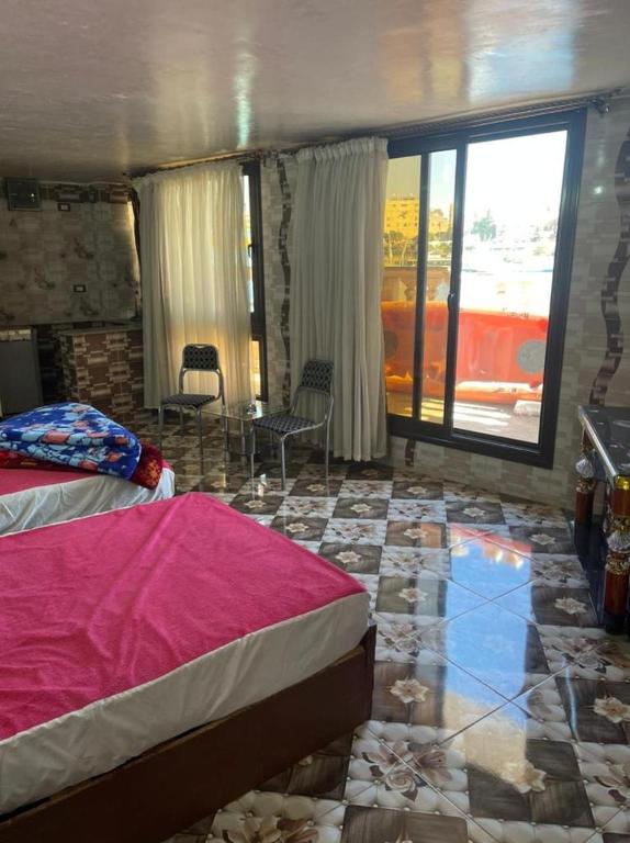 Postel nebo postele na pokoji v ubytování Nubian Dreams Guest House