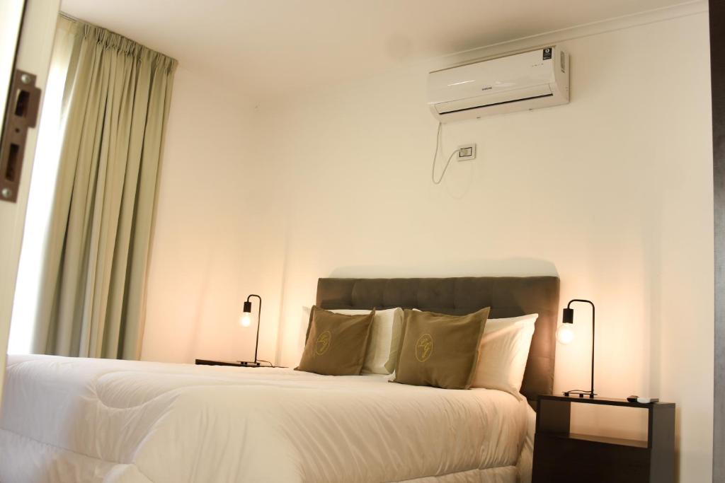 Postel nebo postele na pokoji v ubytování La Gioconda Apart Hotel