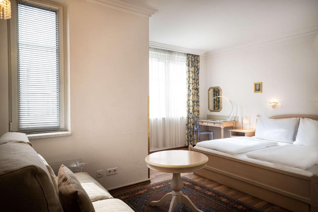 Postel nebo postele na pokoji v ubytování Arthotel ANA Gala
