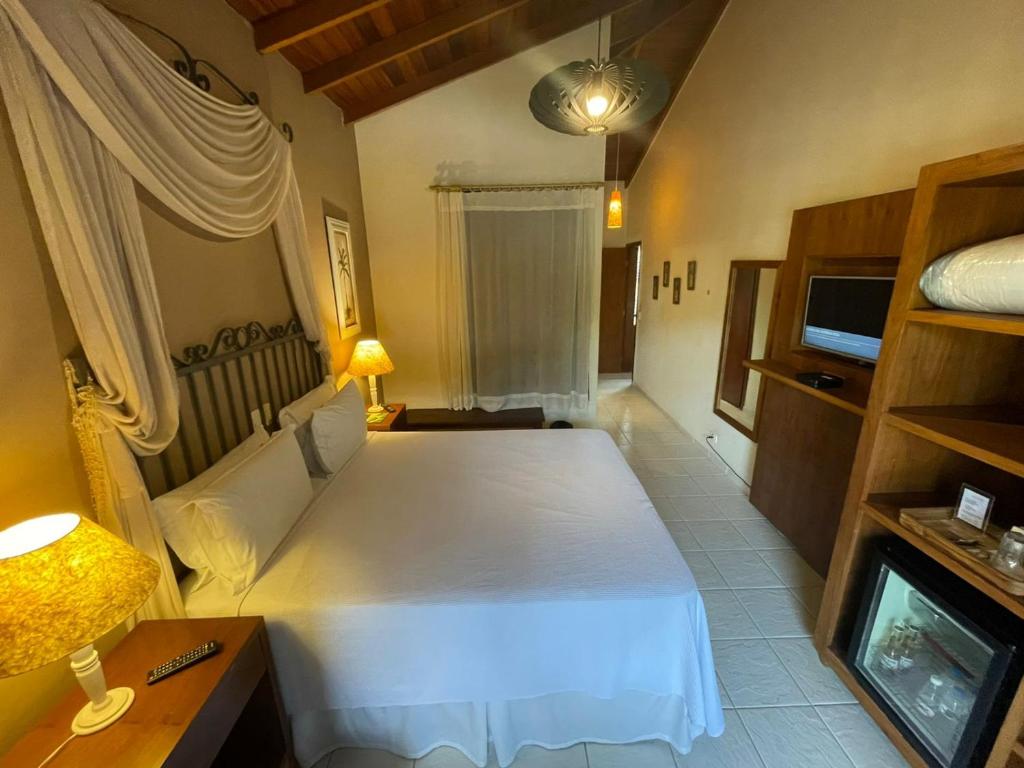 Cama ou camas em um quarto em Hiu Hotel