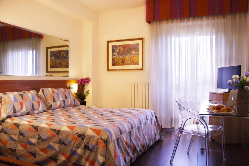 Postel nebo postele na pokoji v ubytování Ilgo Hotel