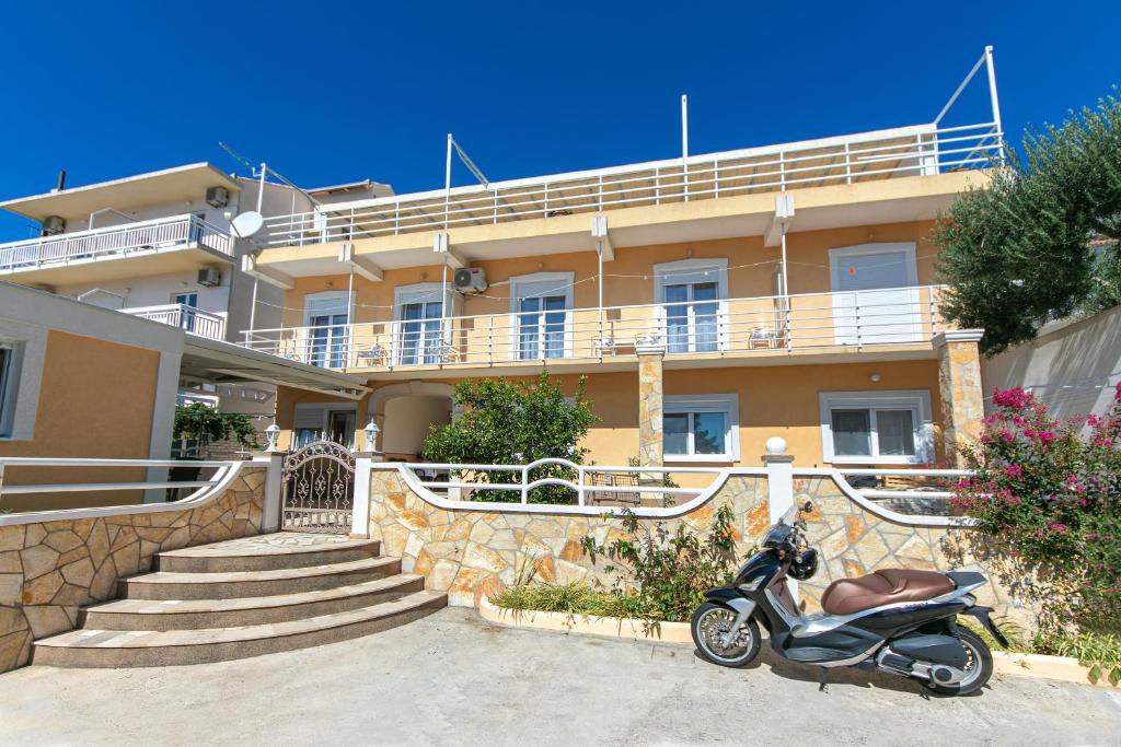 a scooter parked in front of a building at Apartments with parking space Gradac, Makarska - 5198 in Gradac