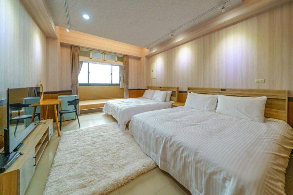 Voodi või voodid majutusasutuse 鼎愛溫泉行館 toas