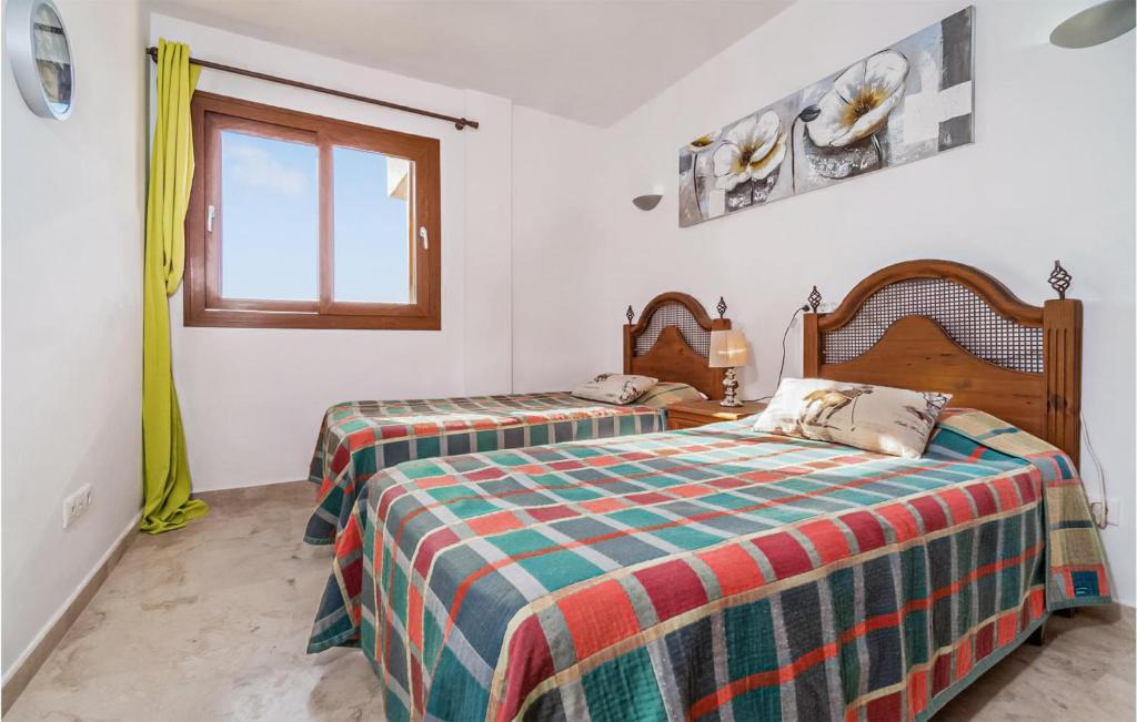 A bed or beds in a room at Cozy Apartment In Torrevieja