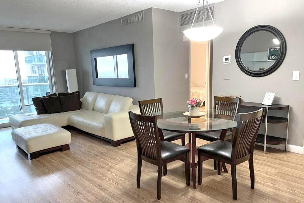 a living room with a table and a couch at THE TIDES 1bedroom apt 15th floor WE ARE ON THE BEACH! in Hollywood