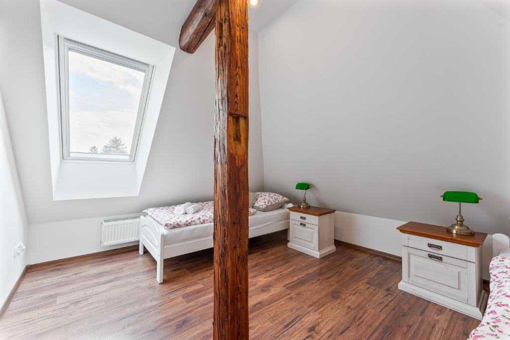 Postel nebo postele na pokoji v ubytování Villa Libosad