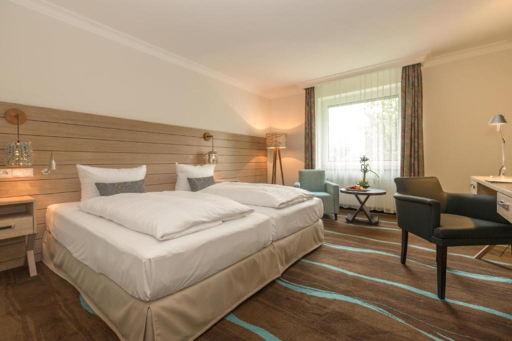 Postel nebo postele na pokoji v ubytování Hotel Der Seehof