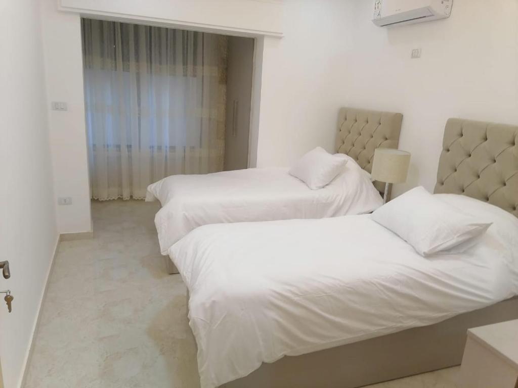 Postel nebo postele na pokoji v ubytování Executive Apartments