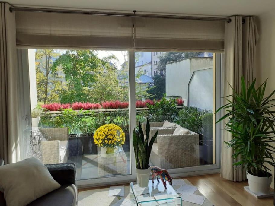 a living room with a large sliding glass door at Appt centre ville "Parc Olympe de Gouges" avec garage in Annemasse