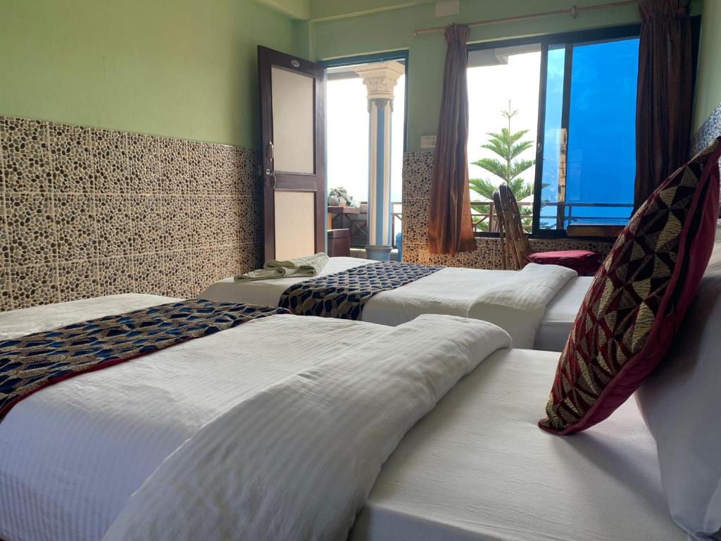 Letto o letti in una camera di Lake Vision Guesthouse