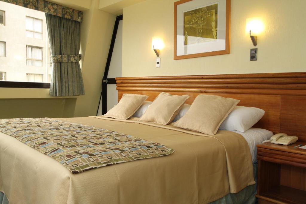 Postel nebo postele na pokoji v ubytování Gala Hotel