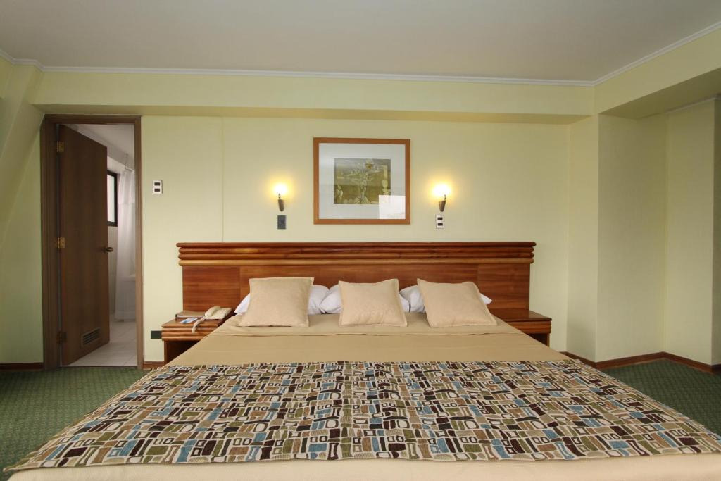 Postel nebo postele na pokoji v ubytování Gala Hotel
