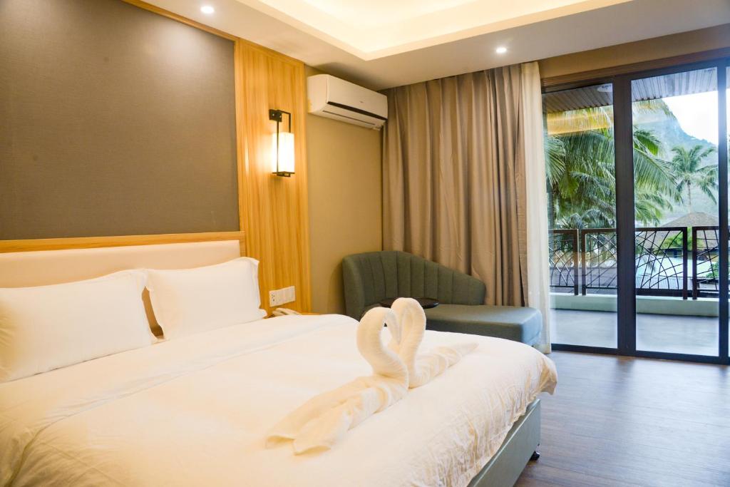 Postel nebo postele na pokoji v ubytování El Nido Garden Resort