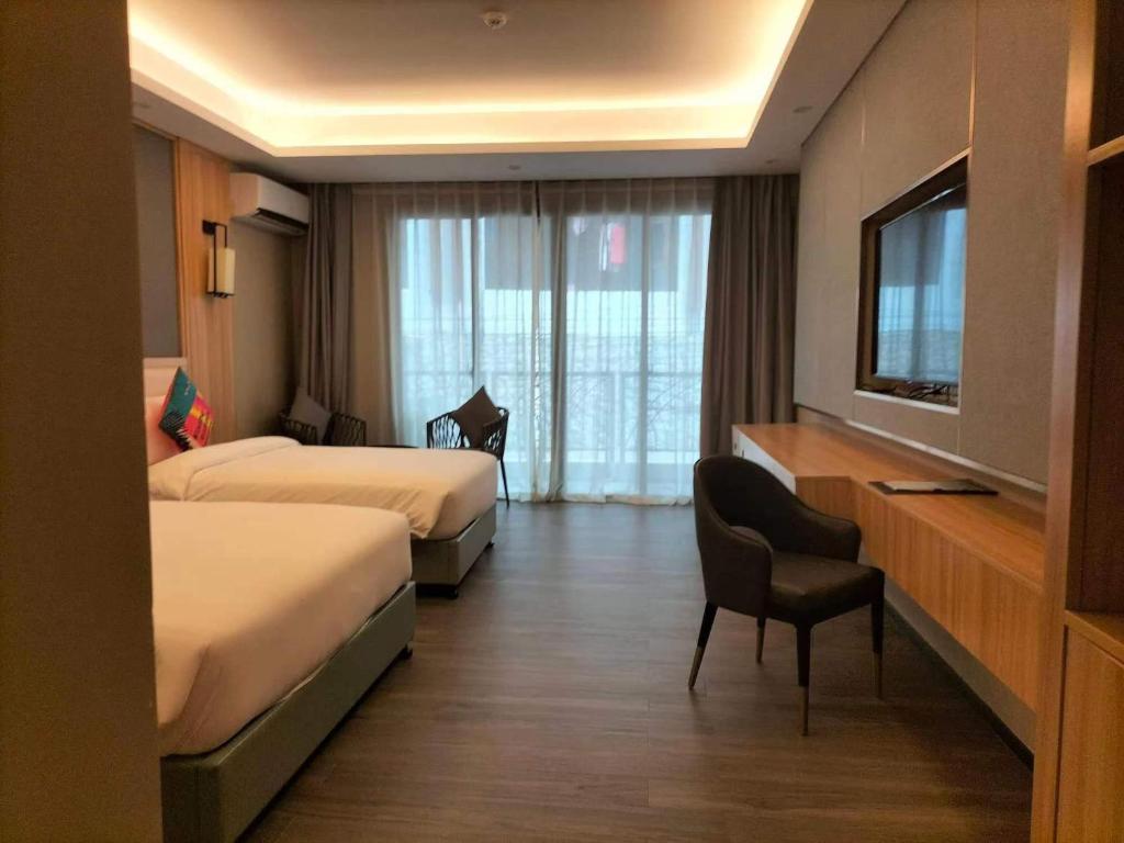 Postel nebo postele na pokoji v ubytování El Nido Garden Resort