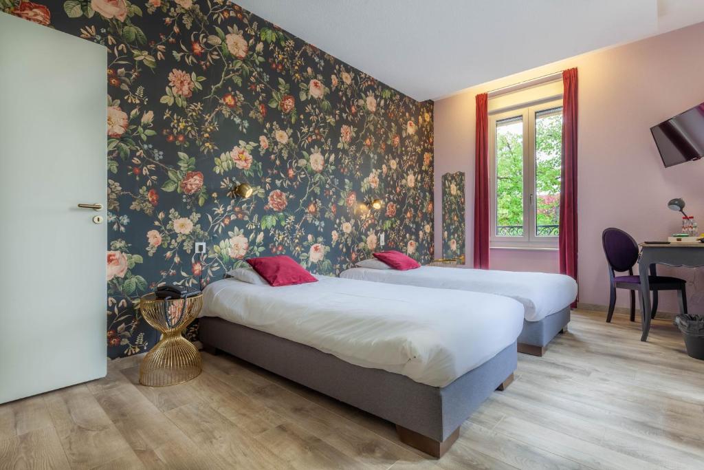 Postel nebo postele na pokoji v ubytování Hôtel d'Angleterre