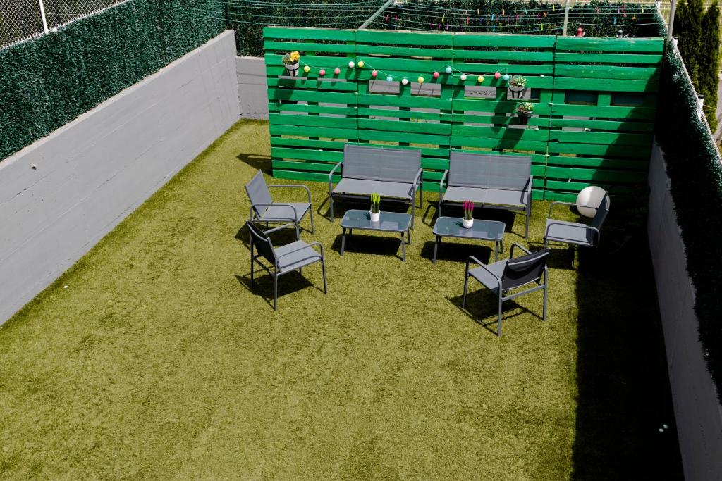 an overhead view of chairs and tables and a green wall at Suseia in Zubiri