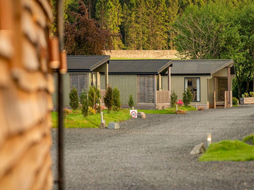 a row of cottages on the side of a road at Lodge 11 - The Lawns in Perth