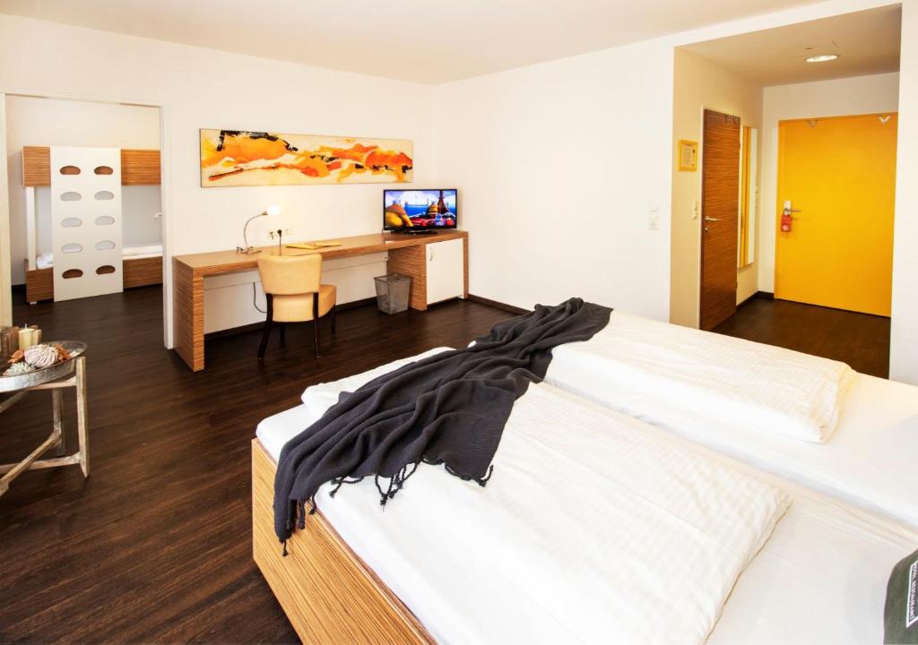 Postel nebo postele na pokoji v ubytování Hotel Restaurant Winkler