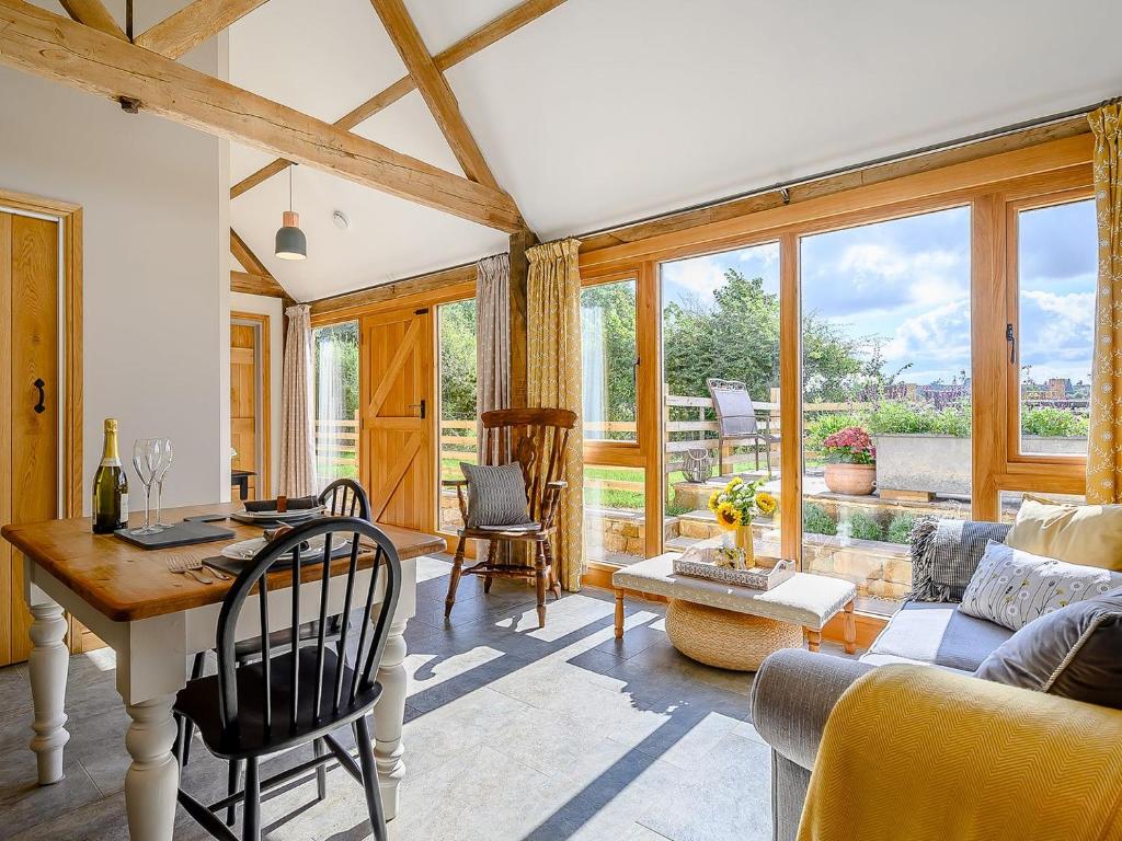 a living room with a table and a couch at The Hovel in Fenny Compton