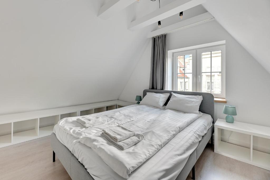 Posteľ alebo postele v izbe v ubytovaní Comfort Apartments Długi Targ