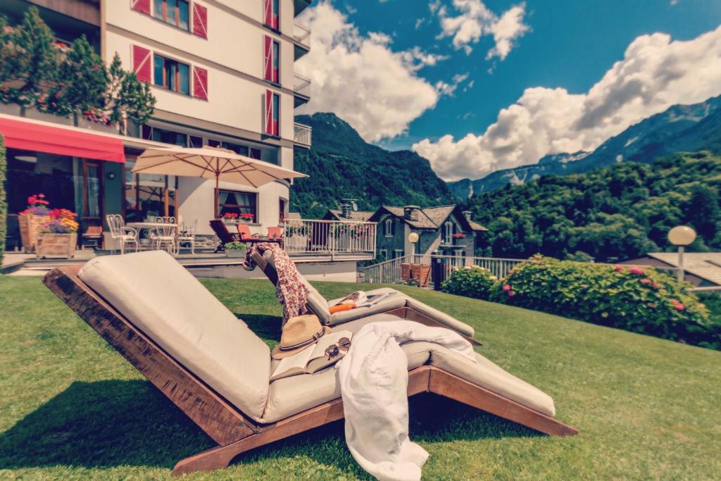 a sculpture of a person laying on a couch with a giraffe at Hotel Tremoggia in Chiesa in Valmalenco
